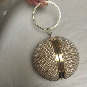 Gold round pearl and rhinestone clutch with handle or removable strap. NWT